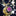 Gold necklace with a pink gemstone pendant against a blurred background-3